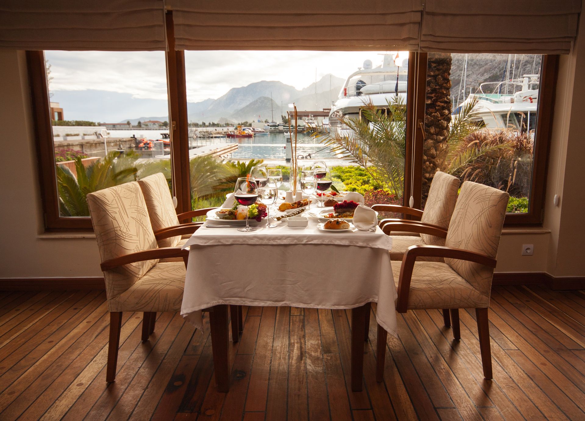 The communal dining table set for dinner, facing the Atlantic
